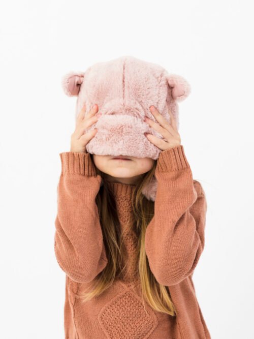 cute-girl-covering-her-face-with-winter-hat ولادي بيت (نسخة)